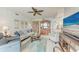 Inviting living room with comfortable seating, ceiling fan, and view to dining at 23261 Banbury Way # 501, Venice, FL 34293