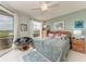 Bright bedroom with picturesque window views, ample natural light, and tasteful decor at 23261 Banbury Way # 501, Venice, FL 34293