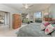 Bedroom featuring tranquil views from large windows that bring the outdoors inside at 23261 Banbury Way # 501, Venice, FL 34293