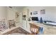 Office featuring a large desk, rolling chair, printer and cabinets with decor at 23261 Banbury Way # 501, Venice, FL 34293