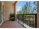 Outdoor balcony with tiled flooring and iron railing perfect for enjoying nature views at 2333 Gulf Of Mexico Dr # 1A2, Longboat Key, FL 34228