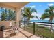 Cozy balcony with bistro seating overlooking ocean and beach, creating a peaceful and private retreat at 2333 Gulf Of Mexico Dr # 1A2, Longboat Key, FL 34228