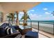 Relaxing balcony with comfortable couch and great ocean views, perfect for enjoying the outdoors at 2333 Gulf Of Mexico Dr # 1A2, Longboat Key, FL 34228