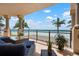Breezy balcony offers stunning ocean views and comfortable seating for relaxing by the beach at 2333 Gulf Of Mexico Dr # 1A2, Longboat Key, FL 34228