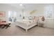 Bright bedroom with a coastal theme, featuring a plush bed and access to a private balcony at 2333 Gulf Of Mexico Dr # 1A2, Longboat Key, FL 34228