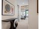 The bedroom is visible from the hallway with its trey ceiling, and a blue color scheme with lots of natural light at 2333 Gulf Of Mexico Dr # 1A2, Longboat Key, FL 34228