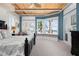 This bedroom has a trey ceiling, and a blue color scheme with lots of natural light and beautiful ocean views at 2333 Gulf Of Mexico Dr # 1A2, Longboat Key, FL 34228