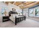 This bedroom has a trey ceiling, and a blue color scheme with lots of natural light and beautiful ocean views at 2333 Gulf Of Mexico Dr # 1A2, Longboat Key, FL 34228