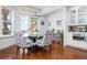 Cozy dining area with ocean views, modern light fixtures, and built-in cabinetry for elegant storage at 2333 Gulf Of Mexico Dr # 1A2, Longboat Key, FL 34228