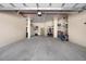 Spacious three car garage with a large storage area, tiled floors and plenty of lighting at 2333 Gulf Of Mexico Dr # 1A2, Longboat Key, FL 34228