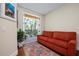 Comfortable sitting area with outdoor views of trees and a balcony for relaxing outside at 2333 Gulf Of Mexico Dr # 1A2, Longboat Key, FL 34228