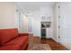 Relaxing sitting area with a wet bar including a cooler and overhead storage for convenience at 2333 Gulf Of Mexico Dr # 1A2, Longboat Key, FL 34228
