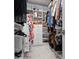 Organized walk-in closet with multiple shelves, drawers, and hanging rods, providing efficient storage solutions at 2333 Gulf Of Mexico Dr # 1A2, Longboat Key, FL 34228