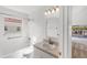 Well-lit bathroom with a bathtub, a shower, and a vanity with a large mirror at 2435 E Del Webb Blvd, Sun City Center, FL 33573