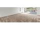 Large bedroom with big windows offering lots of natural light and lanai access at 2435 E Del Webb Blvd, Sun City Center, FL 33573