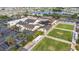 Aerial photo features a community center, pool, lawn bowling area, and ample parking at 2435 E Del Webb Blvd, Sun City Center, FL 33573
