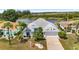 Beautifully landscaped single-Gathering home with a charming front yard and stunning waterfront view at 2435 E Del Webb Blvd, Sun City Center, FL 33573