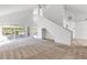 Spacious living room boasts soaring ceilings, natural light, and lanai access at 2435 E Del Webb Blvd, Sun City Center, FL 33573
