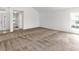 Large living room with plush carpeting, neutral walls, and an inviting ambiance at 2435 E Del Webb Blvd, Sun City Center, FL 33573