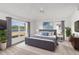 Spacious main bedroom with a calming lake view, a ceiling fan, and a soothing color palette at 2435 E Del Webb Blvd, Sun City Center, FL 33573