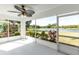 Screened porch with view of landscaping and waterfront at 2435 E Del Webb Blvd, Sun City Center, FL 33573