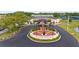 Aerial view of a veterans memorial surrounded by greenery, and a well-maintained landscape at 2435 E Del Webb Blvd, Sun City Center, FL 33573