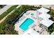 Aerial view of the pool, spa, and outdoor lounge area at 2450 Harbourside Dr # 251, Longboat Key, FL 34228
