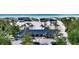 Aerial view showcasing community beach access with picnic shelters and lush tropical foliage at 2450 Harbourside Dr # 251, Longboat Key, FL 34228