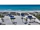Community beach access boasting picnic shelters and lush tropical foliage, with ocean views at 2450 Harbourside Dr # 251, Longboat Key, FL 34228