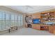 Empty bedroom offering a picturesque view with custom built-ins and ample natural light at 2450 Harbourside Dr # 251, Longboat Key, FL 34228