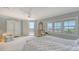 Light-filled bedroom offers a private balcony and stunning views of the city at 2450 Harbourside Dr # 251, Longboat Key, FL 34228