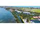 Waterfront condo building boasts beautiful water views, manicured lawns, and lush landscaping at 2450 Harbourside Dr # 251, Longboat Key, FL 34228