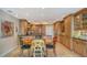 Bright kitchen and dining area with custom cabinets, countertops, and flooring at 2450 Harbourside Dr # 251, Longboat Key, FL 34228