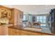 Gourmet kitchen with granite counters and custom cabinets showcases ocean views at 2450 Harbourside Dr # 251, Longboat Key, FL 34228