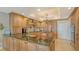Gourmet kitchen features a large island, custom cabinetry, and high-end stainless appliances at 2450 Harbourside Dr # 251, Longboat Key, FL 34228