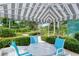Outdoor patio with comfortable seating and shaded canopy at 2450 Harbourside Dr # 251, Longboat Key, FL 34228