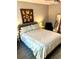 Cozy bedroom with neutral tones, a comfortable bed, and stylish decor at 2601 Pine Lake Ter # B, Sarasota, FL 34237