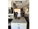 Modern kitchen with stainless steel appliances, granite countertops, and an island with breakfast bar seating at 2601 Pine Lake Ter # B, Sarasota, FL 34237