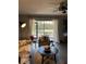 Serene living room featuring a screened-in patio, cozy seating, and natural light at 2601 Pine Lake Ter # B, Sarasota, FL 34237