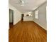 Bright living room featuring wood floors with combined living and dining areas at 2622 E 27Th Ave, Tampa, FL 33605