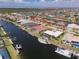 Picture perfect waterfront homes and canals featuring private docks and boat lifts under sunny skies at 2817 La Mancha Ct, Punta Gorda, FL 33950