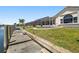 Expansive backyard with seawall, boat dock, and extended screened lanai at 2817 La Mancha Ct, Punta Gorda, FL 33950