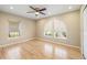 Bright bedroom features hardwood floors and unique arched windows at 2817 La Mancha Ct, Punta Gorda, FL 33950