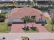 Stunning waterfront home featuring a red tile roof, charming front yard landscaping, and beautiful canal views at 2817 La Mancha Ct, Punta Gorda, FL 33950