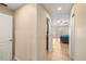 Hallway leading to bedroom with a ceiling fan and tile floors at 2817 La Mancha Ct, Punta Gorda, FL 33950