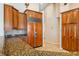 Kitchen with granite countertops, wood cabinets, and stainless steel refrigerator at 2817 La Mancha Ct, Punta Gorda, FL 33950