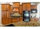 Kitchen with granite countertops, wood cabinets, and stainless steel appliances at 2817 La Mancha Ct, Punta Gorda, FL 33950