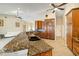 Spacious kitchen with granite countertops, wood cabinets, and stainless steel appliances at 2817 La Mancha Ct, Punta Gorda, FL 33950