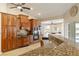 Open kitchen with granite countertops, wood cabinets, and stainless steel appliances at 2817 La Mancha Ct, Punta Gorda, FL 33950