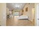 Bright living room featuring tile floors, high ceilings, and sliding glass doors leading to the lanai at 2817 La Mancha Ct, Punta Gorda, FL 33950